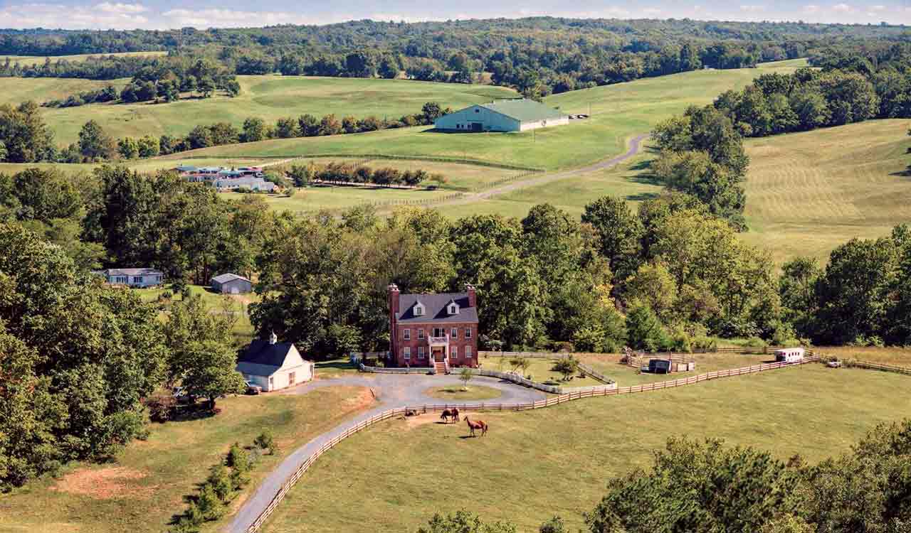 Endwyke Farm in Appomattox Virginia with a Federal-style country home, flowering gardens, barn, pasture, and equestrian property appeal